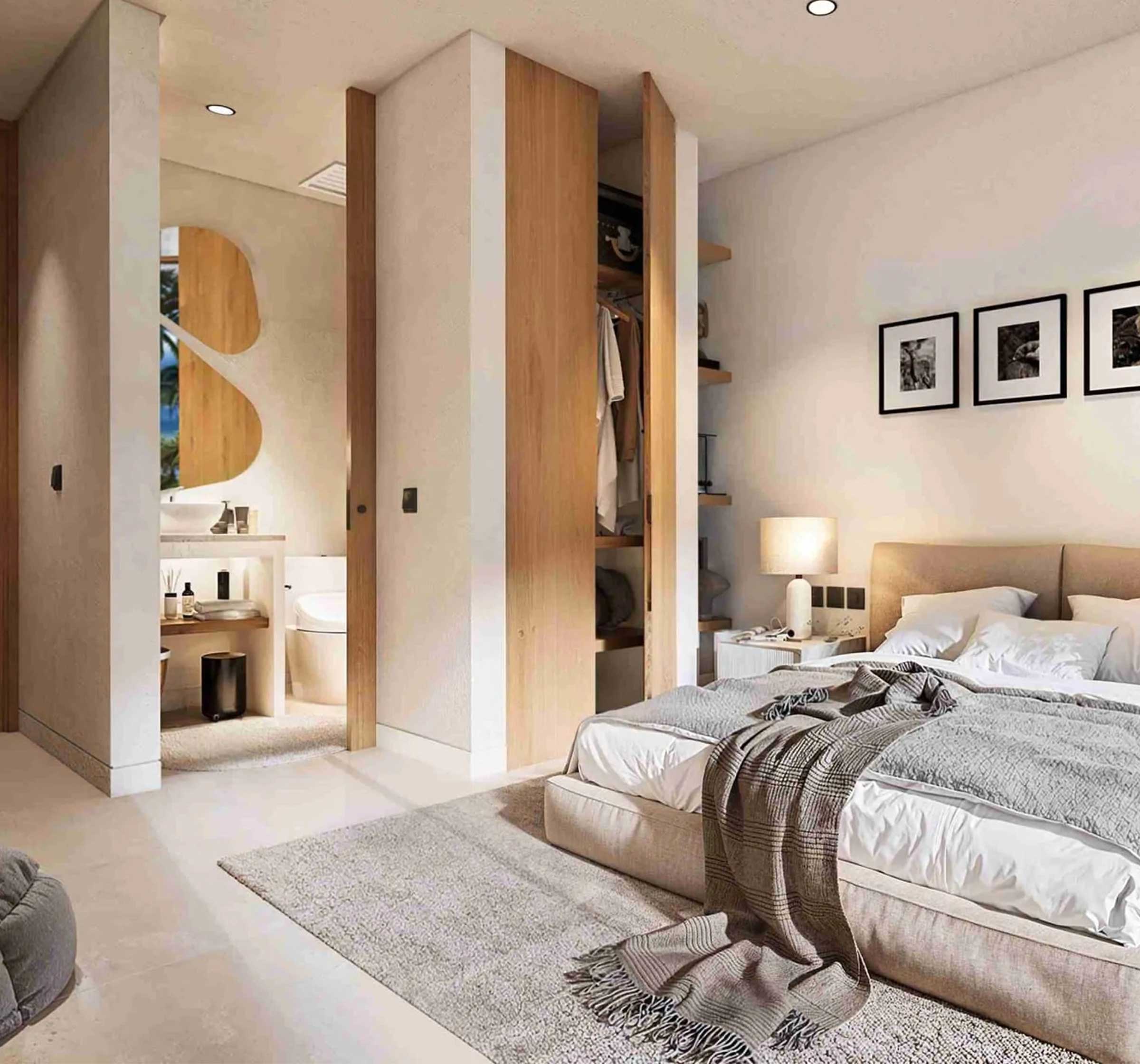 Modern master bedroom with organic wood sliding doors and ensuite bathroom at The Novéra Beyond luxury villa in Uluwatu, Bali.